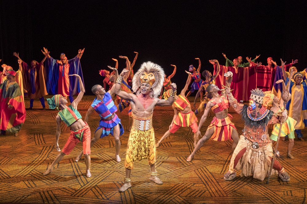 Gerald Caesar as “Simba” and company in THE LION KING, North American Tour. ©Disney. Photo by Deen van Meer.