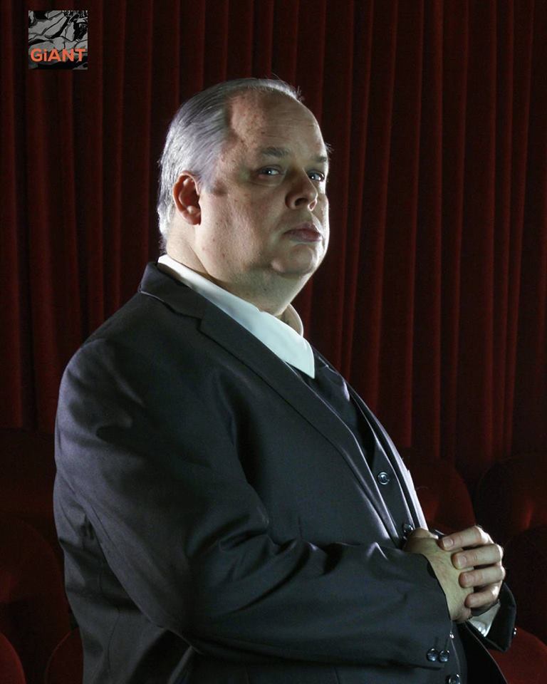 Brad Smith as Alfred Hitchcock