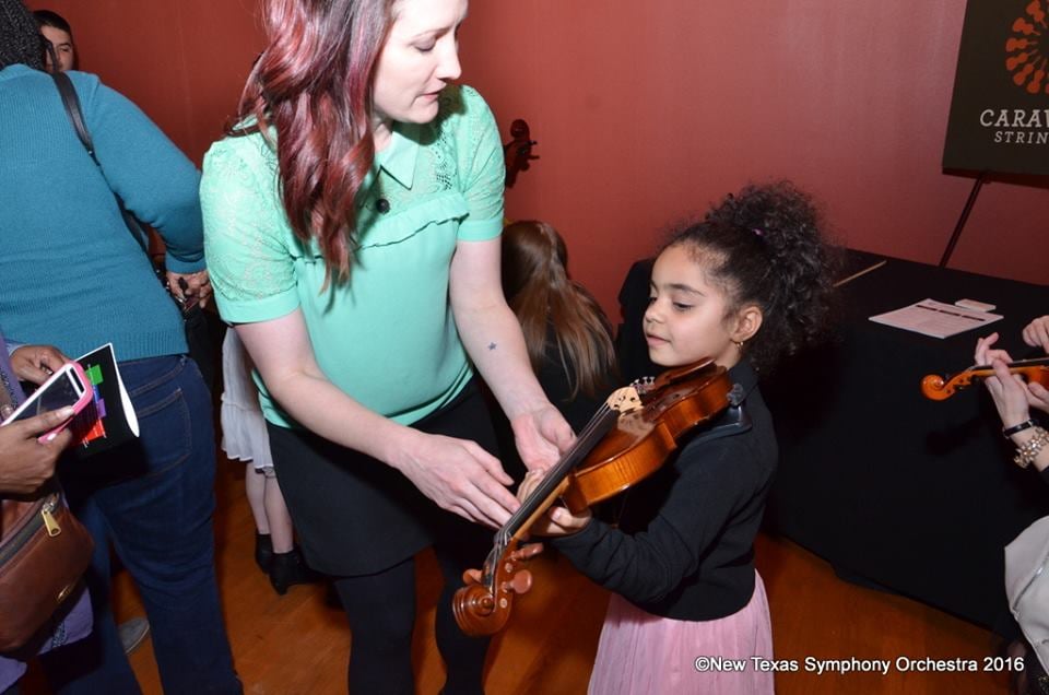 Try on the violin for size at an instrument "petting zoo." Photo: New Texas Symphony Orchestra
