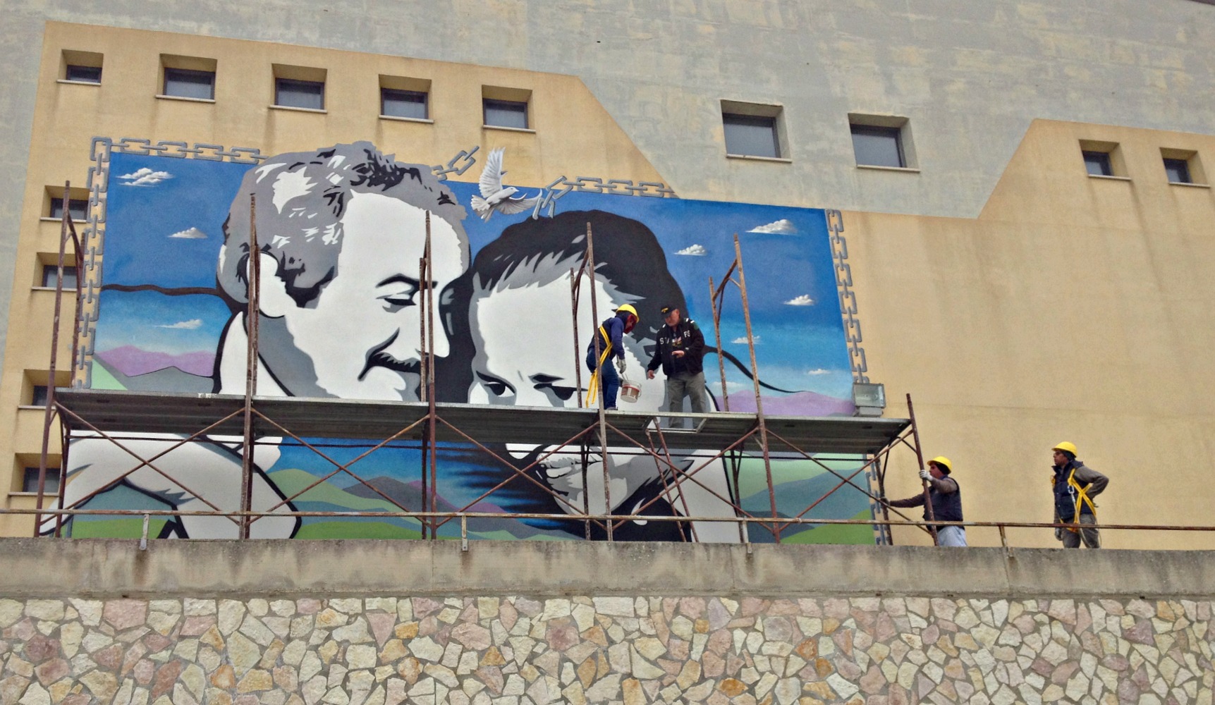 The scaffolding coming down on Frank Campagna's mural of Giovanni Falcone and Paulo Borsellino, the judges assassinated by the Mafia. 