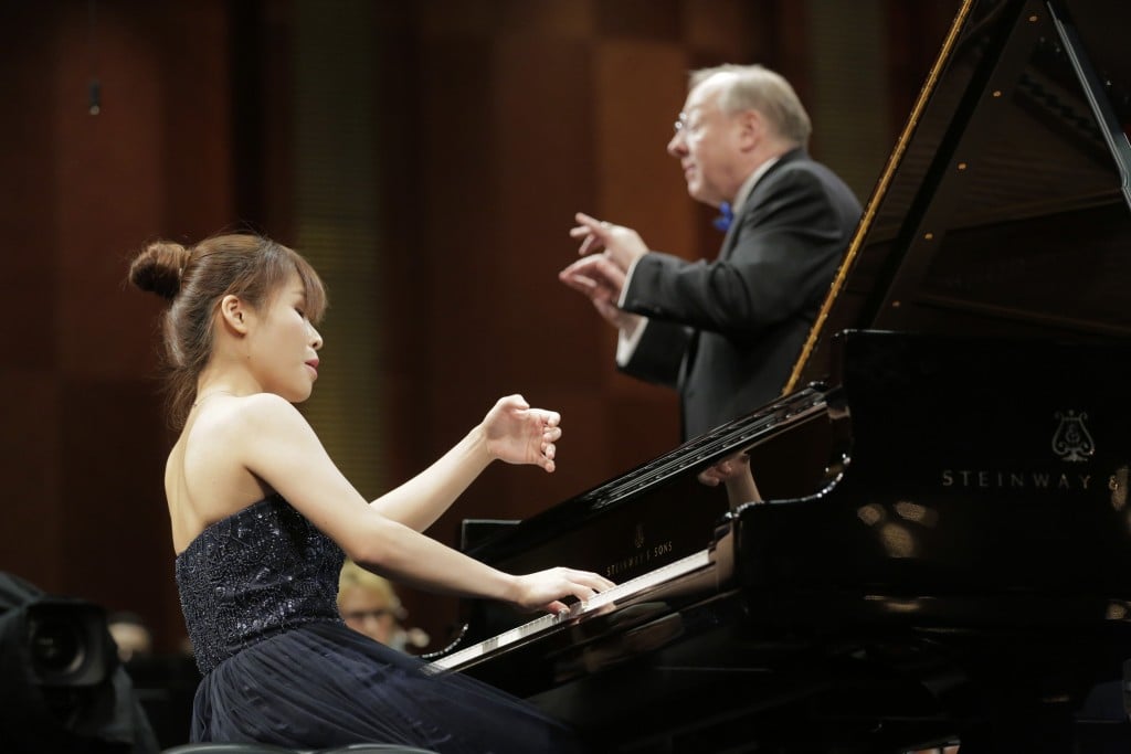 June 5, 2017- Rachel Cheung from Hong Kong performs with conductor Nicholas McGegan and the Fort Worth Symphony Orchestra Sunday during his concerto in the Semifinal round at The Fifteenth Van Cliburn International Piano Competition held at Bass Performance Hall in Fort Worth, Texas. (Photo Ralph Lauer)