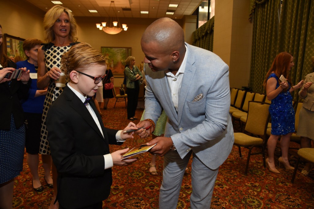 Christopher Jackson giving a young fan his autograph. Photo: Junior Players