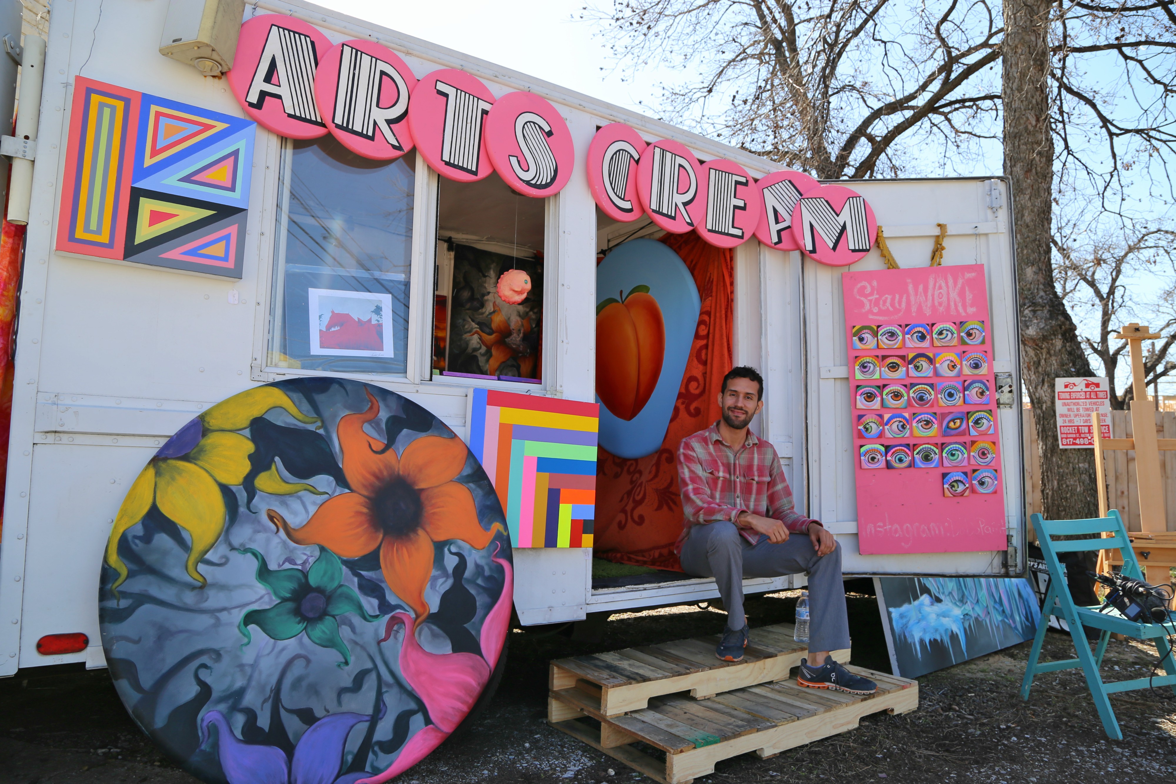 Arnoldo Hurtado sitting in front of his ArtsCream Truck. Photo: Hady Mawajdeh