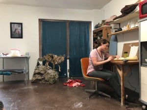 Morgan Grasham sits in her studio working on animal sculptures for a solo exhibition at UNT. Photo: Hady Mawajdeh