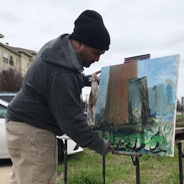 Jerrel Sustaita with his painting