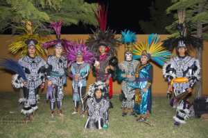 dance performers in Aztec costumes