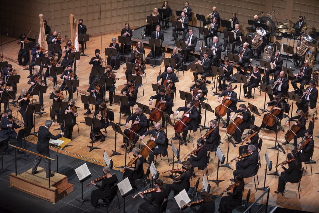 An overhead shot of concert musicians on stage at Meyerson center.